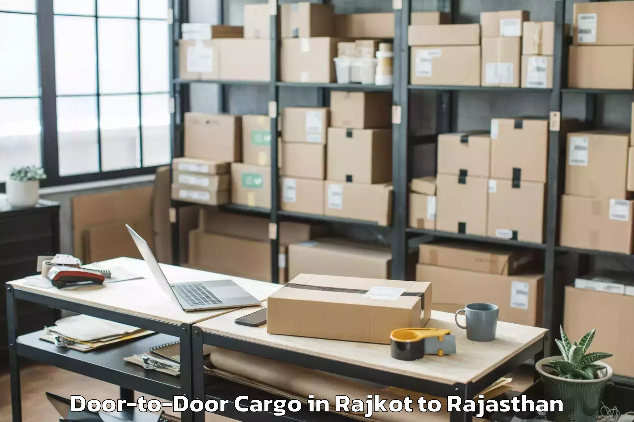 Reliable Rajkot to Meethari Marwar Door To Door Cargo